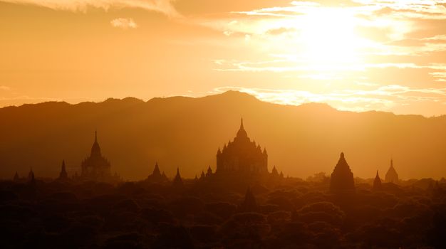 Beautiful golden sunset panoramic landscape view with ancient temples at Bagan, Myanmar
