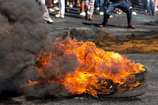 Protesters against the government burning rubber tyres in the streets in South Africa