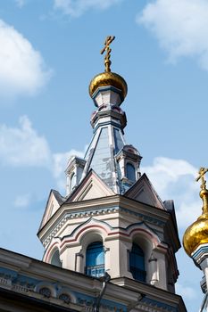 Close up view of Orthodox Ss Boris and Gleb Cathedral in Dougavpils, Latvia, on blue cloudy sky background.