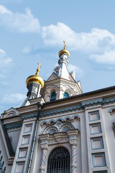 view of Orthodox Ss Boris and Gleb Cathedral in Dougavpils, Latvia, on blue sky background.