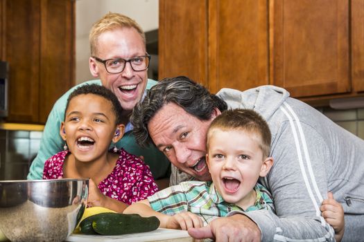 Same sex couple and kids having fun at meal time