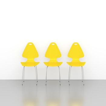 An image of three yellow chairs in a row