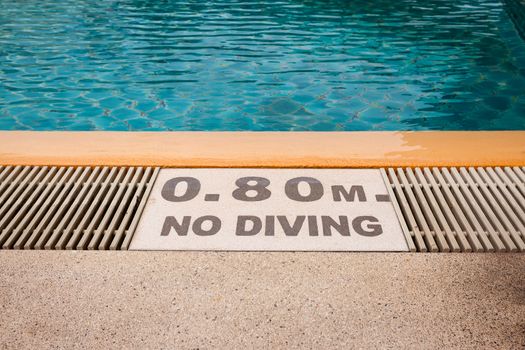 warning sign "0.80m No Diving" at Swimming pool of luxury hotel