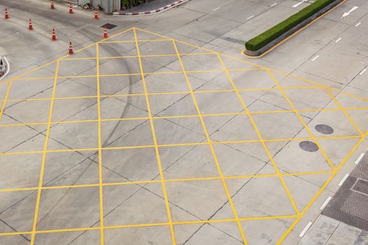 crossing with road marking white arrows and rectangles on asphalt road