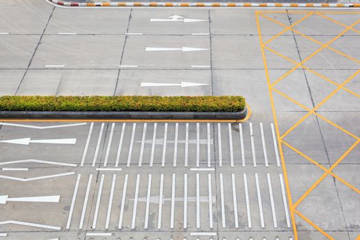 crossing with road marking white arrows and rectangles on asphalt road