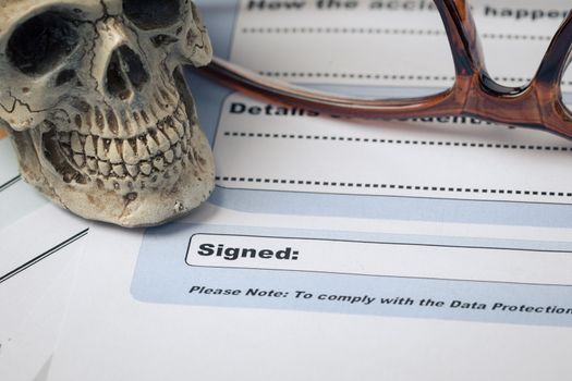 Signature field on document with pen and skull signed here; document is mock-up