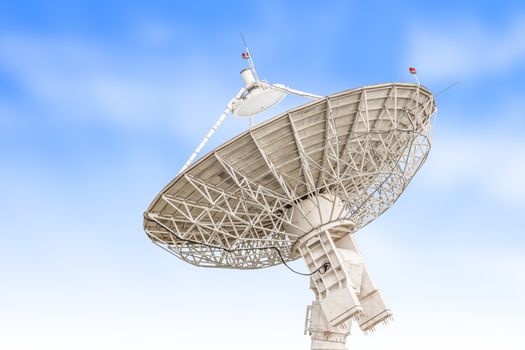 satellite dish antenna radar big size isolated on blue sky background