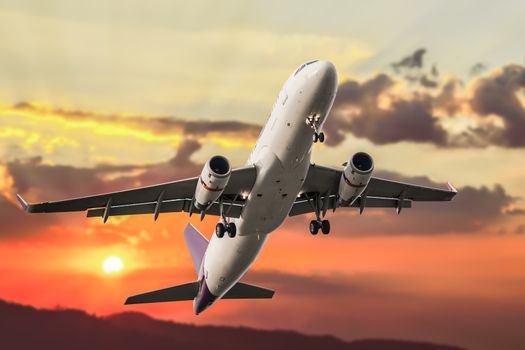 Passenger business airplane take off and flying on sky sunset, use for air transport, journey and travel concept