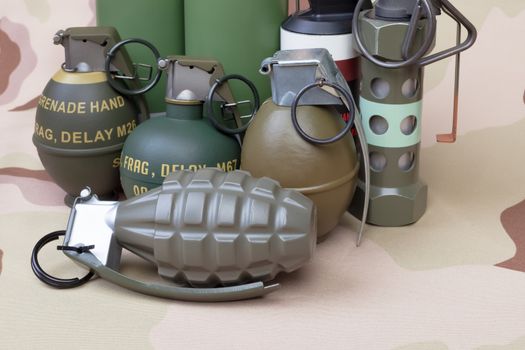 All explosives, weapon army,standard time fuze, hand grenade on camouflage background