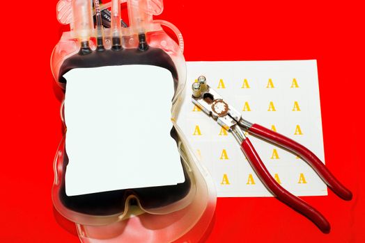 Close up bag of blood and plasma group A isolated on Red background