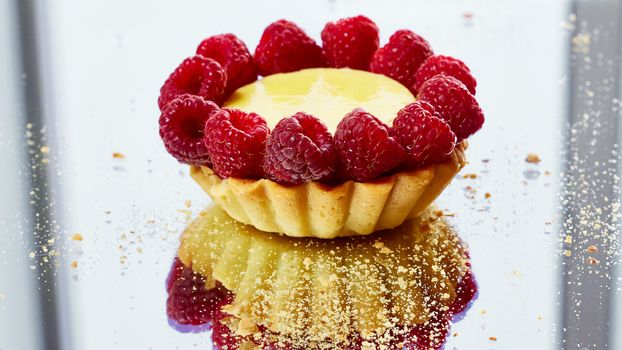 Home made tartlets with raspberries. With copy space