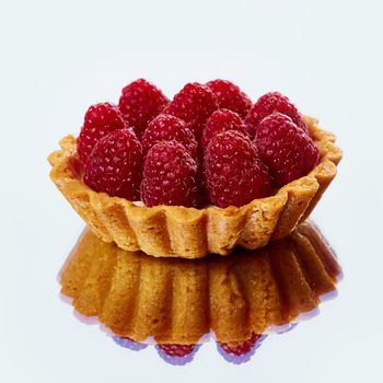 Home made tartlets with raspberries. With copy space