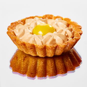 Sweet tartlets filled with cream. With copy space