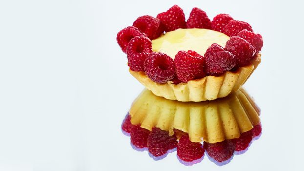 Home made tartlets with raspberries. With copy space