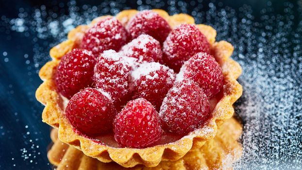 Home made tartlets with raspberries. With copy space