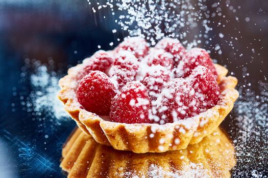 Home made tartlets with raspberries. With copy space