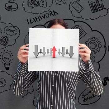 Businesswoman showing a white card in front of her face against grey