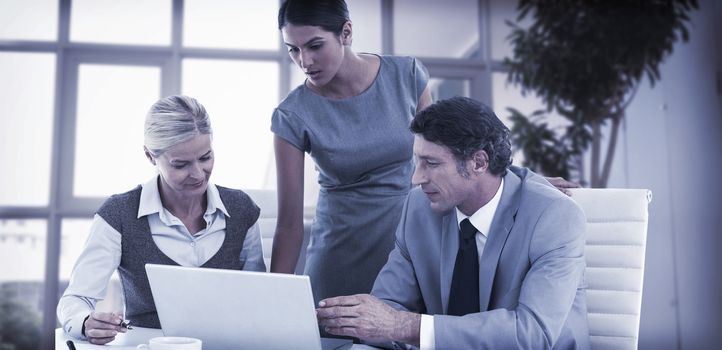 Business people using laptop in the office