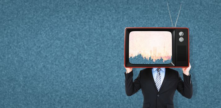 Businessman hiding head with a box against orange