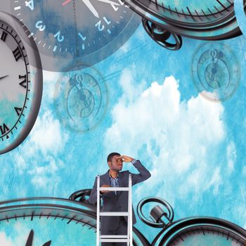 Businessman standing on ladder looking against painted blue sky