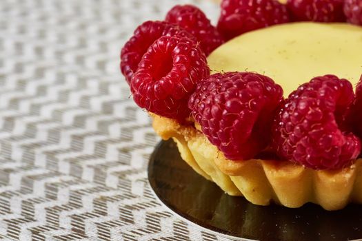 Home made tartlets with raspberries. With copy space