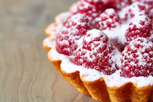 Home made tartlets with raspberries. With copy space