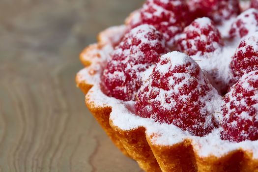 Home made tartlets with raspberries. With copy space