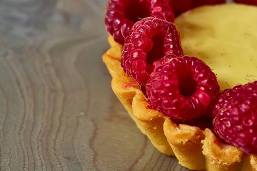 Home made tartlets with raspberries. With copy space