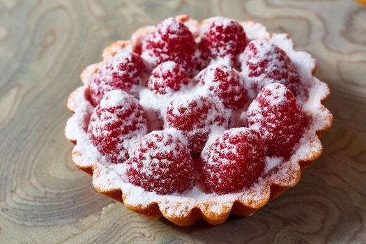 Home made tartlets with raspberries. With copy space