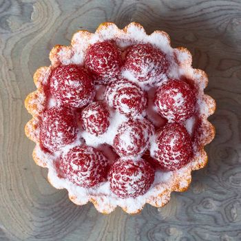 Home made tartlets with raspberries. With copy space