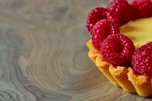 Home made tartlets with raspberries. With copy space