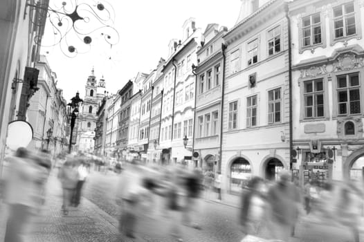 Crowd of people in streets of Prague. Photo in retro vintage style.