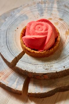 Home made tartlet rose on wooden background. Shallow dof