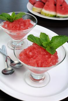 Refreshing watermelon granita with mint on a table