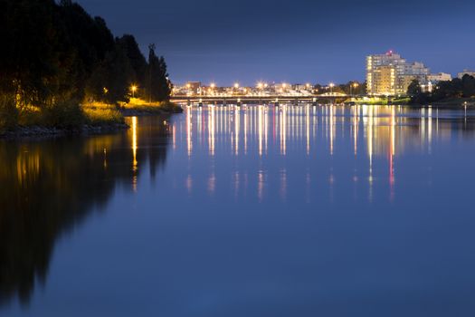 Downtown Umeå, Sweden at Night overlooking the river.