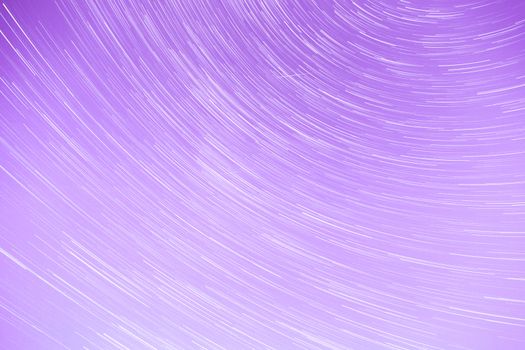 Star Trails streaking across a Purple Sky.