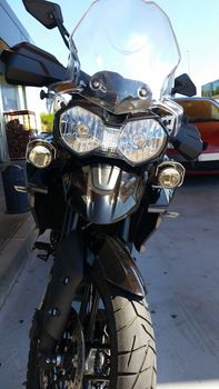 Black Adventure Motorcycle at a gas station in Barcelona, Spain