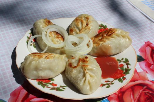 Asian national food (Fried manty). As it is cooked in Kyrgyzstan.