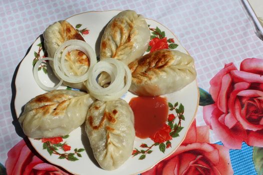 Asian national food (Fried manty). As it is cooked in Kyrgyzstan.