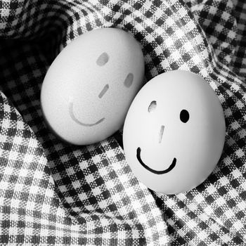 smile love egg couple in brown kitchen towel on wood table black and white color tone style