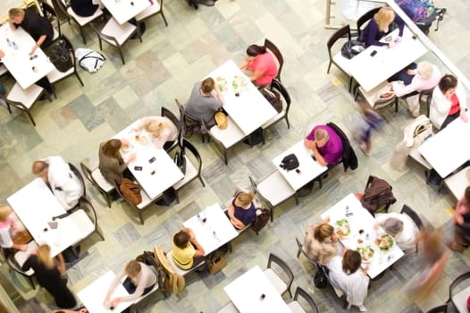 Food ang drink conceptual image. Cafeteria from above with a lot of people.