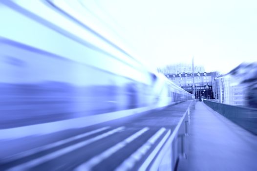 Transportation conceptual image. A speeding train on rails. Motion blur picture.