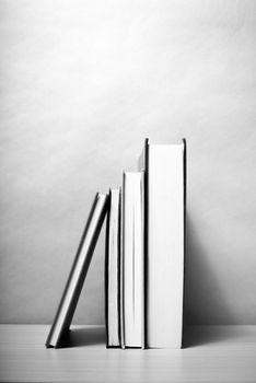 stand up of book on wood table background black and white color tone style