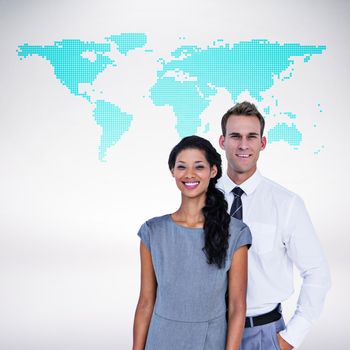 Happy business people smiling at camera  against green world map on white background