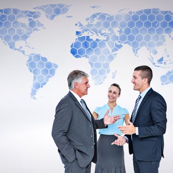 Business people standing and talking against background with world map