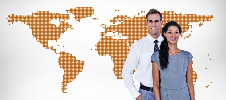 Happy business people smiling at camera  against orange world map on white background