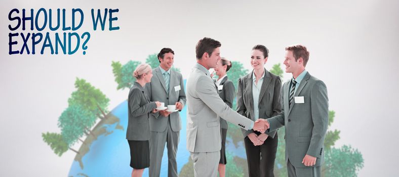 Business people shaking hands  against grey background