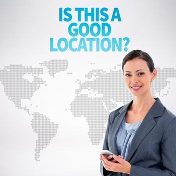 Businesswoman with phone against orange world map on white background
