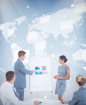 Manager presenting statistics to his colleagues against world map with envelopes