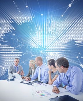 Business team having a meeting against glowing world map on black background